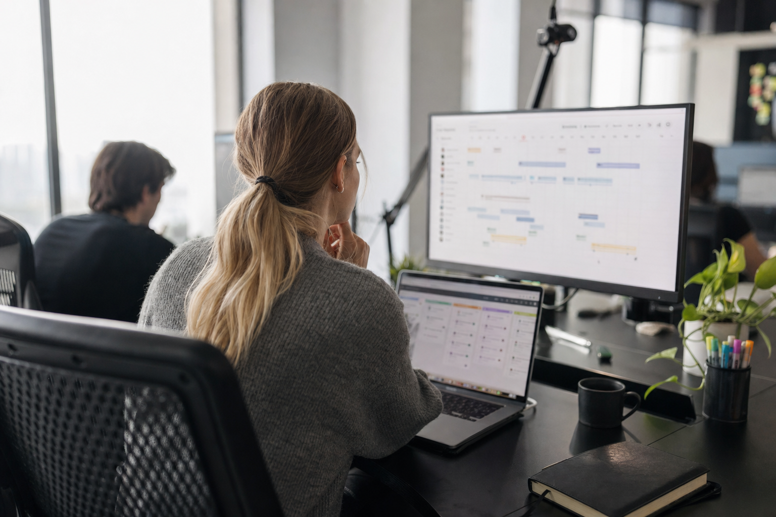 Marketing operations manager monitoring a content publishing workflow in a modern office